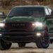 A green 2026 Ram 1500 Rebel parked off-road.