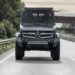 A gray 2026 Mercedes-Benz Unimog driving down a highway